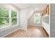 Bright bedroom with hardwood floors and two windows, complemented by built-in bunk beds at 2356 Pinkney Dr, Marietta, GA 30062