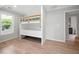 Bedroom features hardwood floors, built-in bunk beds, and a view of the outdoors through a window at 2356 Pinkney Dr, Marietta, GA 30062