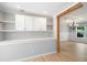 Bright dining area with custom built in cabinets and adjacent dining room at 2356 Pinkney Dr, Marietta, GA 30062
