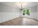Elegant dining room with wainscoting, coffered ceiling, and large window at 2356 Pinkney Dr, Marietta, GA 30062