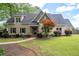 Inviting home exhibits a neatly landscaped yard and charming exterior details at 2356 Pinkney Dr, Marietta, GA 30062