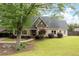 Charming home boasts a well-manicured lawn, lush landscaping, and a classic architectural style at 2356 Pinkney Dr, Marietta, GA 30062