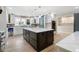 Open kitchen with large island, brick backsplash, pantry, and stainless appliances at 2356 Pinkney Dr, Marietta, GA 30062