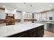 Well appointed kitchen featuring a large island, brick backsplash, and stainless appliances at 2356 Pinkney Dr, Marietta, GA 30062