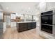 Spacious kitchen with large island, brick backsplash, and stainless steel appliances at 2356 Pinkney Dr, Marietta, GA 30062