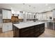 Modern kitchen features a large island with a marble countertop and brick backsplash at 2356 Pinkney Dr, Marietta, GA 30062