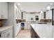 Modern kitchen with island, quartz counters, brick backsplash and stainless appliances at 2356 Pinkney Dr, Marietta, GA 30062