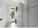 Bright laundry room with stacked washer/dryer and ample cabinet space at 2356 Pinkney Dr, Marietta, GA 30062