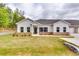 Charming single-Gathering home with white siding, a well-manicured lawn, and a welcoming front entrance at 3859 Shelleydale Dr, Powder Springs, GA 30127