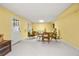 Finished basement area featuring light yellow walls, carpeted floor and walk out entry at 1000 N Harbor Ct, Atlanta, GA 30328
