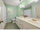 Bright bathroom with double vanity and patterned floor at 1000 N Harbor Ct, Atlanta, GA 30328