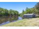 Lakeside home featuring serene water views and a sprawling lawn at 1000 N Harbor Ct, Atlanta, GA 30328