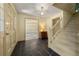 Elegant foyer with slate tile floor, staircase, and views to other rooms at 1000 N Harbor Ct, Atlanta, GA 30328