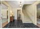 Elegant foyer with a slate floor, staircase, and views into adjoining rooms at 1000 N Harbor Ct, Atlanta, GA 30328