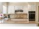 Updated kitchen with modern appliances, granite counters, and tile backsplash at 1000 N Harbor Ct, Atlanta, GA 30328