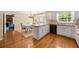 White kitchen featuring an island and an adjacent breakfast nook with lots of natural light at 1000 N Harbor Ct, Atlanta, GA 30328