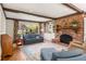 Cozy living room featuring a brick fireplace and exposed wood beams at 1000 N Harbor Ct, Atlanta, GA 30328