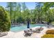 Community pool with lap lanes, lounge chairs, and shaded tables at 1000 N Harbor Ct, Atlanta, GA 30328