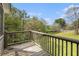 Relax on this back deck with beautiful backyard and pasture views at 105 Blackberry Ct, Woodstock, GA 30188