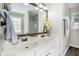 Bright bathroom featuring a double vanity, lots of natural light, and elegant fixtures at 105 Blackberry Ct, Woodstock, GA 30188