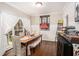 Formal dining room featuring hardwood floors, a large window, and a decorative wine rack at 105 Blackberry Ct, Woodstock, GA 30188