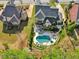Aerial view of backyard pool and patio area with well manicured lawn at 1401 Kings Park Nw Dr, Kennesaw, GA 30152