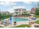 A stunning backyard features a large pool, hot tub, and comfortable lounge areas at 1401 Kings Park Nw Dr, Kennesaw, GA 30152