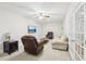Finished basement with comfortable seating, a TV, and natural light from the glass doors at 1401 Kings Park Nw Dr, Kennesaw, GA 30152