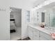 Bright bathroom with double vanity, granite countertop and shower located in the room across the hall at 1401 Kings Park Nw Dr, Kennesaw, GA 30152