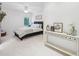 Comfortable bedroom featuring a bed, side table, and decor, with a window offering ample natural light at 1401 Kings Park Nw Dr, Kennesaw, GA 30152
