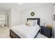 Inviting bedroom featuring a comfortable bed, modern decor, and ample natural light at 1401 Kings Park Nw Dr, Kennesaw, GA 30152