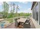 Exterior deck with table and chairs offering beautiful backyard views at 1401 Kings Park Nw Dr, Kennesaw, GA 30152