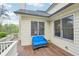 An inviting deck area has a blue loveseat and a garden stool at 1401 Kings Park Nw Dr, Kennesaw, GA 30152