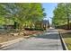 View of a gated community entrance with manicured landscaping and signage at 1401 Kings Park Nw Dr, Kennesaw, GA 30152
