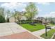 Suburban two-story home with three-car garage, long driveway and beautiful landscaping at 1401 Kings Park Nw Dr, Kennesaw, GA 30152