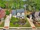 Aerial view of a two story home with manicured landscaping at 1401 Kings Park Nw Dr, Kennesaw, GA 30152