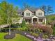 Beautiful two-story home with a well-maintained lawn and garden at 1401 Kings Park Nw Dr, Kennesaw, GA 30152