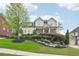 Inviting front exterior with professional landscaping and lush green lawn at 1401 Kings Park Nw Dr, Kennesaw, GA 30152