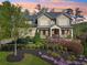 Charming two-story home featuring manicured landscaping and a welcoming front porch at 1401 Kings Park Nw Dr, Kennesaw, GA 30152