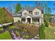 Beautiful two story home with brick accents and manicured front yard at 1401 Kings Park Nw Dr, Kennesaw, GA 30152