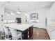 Bright kitchen with an island, stainless appliances, white cabinets and hardwood floors at 1401 Kings Park Nw Dr, Kennesaw, GA 30152