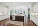 Open kitchen with white cabinets, stainless steel appliances, and a center island at 1401 Kings Park Nw Dr, Kennesaw, GA 30152