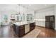 Spacious kitchen with a central island, stainless steel appliances, and open floor plan at 1401 Kings Park Nw Dr, Kennesaw, GA 30152