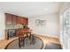 Kitchenette featuring tile backsplash, wood cabinets, and stainless steel appliances, perfect for guests or Gathering members at 1401 Kings Park Nw Dr, Kennesaw, GA 30152