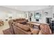Cozy living room with plush seating, built-in shelving, and a large screen TV, perfect for watching a movie with friends and Gathering at 1401 Kings Park Nw Dr, Kennesaw, GA 30152