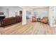 Spacious living room boasts wood flooring, large windows, and open layout for a seamless flow between rooms at 1401 Kings Park Nw Dr, Kennesaw, GA 30152