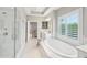 Bathroom featuring a soaking tub and walk-in shower at 1401 Kings Park Nw Dr, Kennesaw, GA 30152