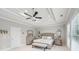 Comfortable main bedroom boasts recessed lighting, neutral paint, and large windows for a bright, airy feel at 1401 Kings Park Nw Dr, Kennesaw, GA 30152