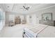 Bright main bedroom featuring neutral decor, large windows, and a tray ceiling for a cozy retreat at 1401 Kings Park Nw Dr, Kennesaw, GA 30152