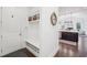 Bright mudroom with bench seating, storage cubbies, and convenient access to the home's interior and featuring stylish decor at 1401 Kings Park Nw Dr, Kennesaw, GA 30152